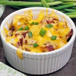 a mini cauliflower casserole topped with green onions.