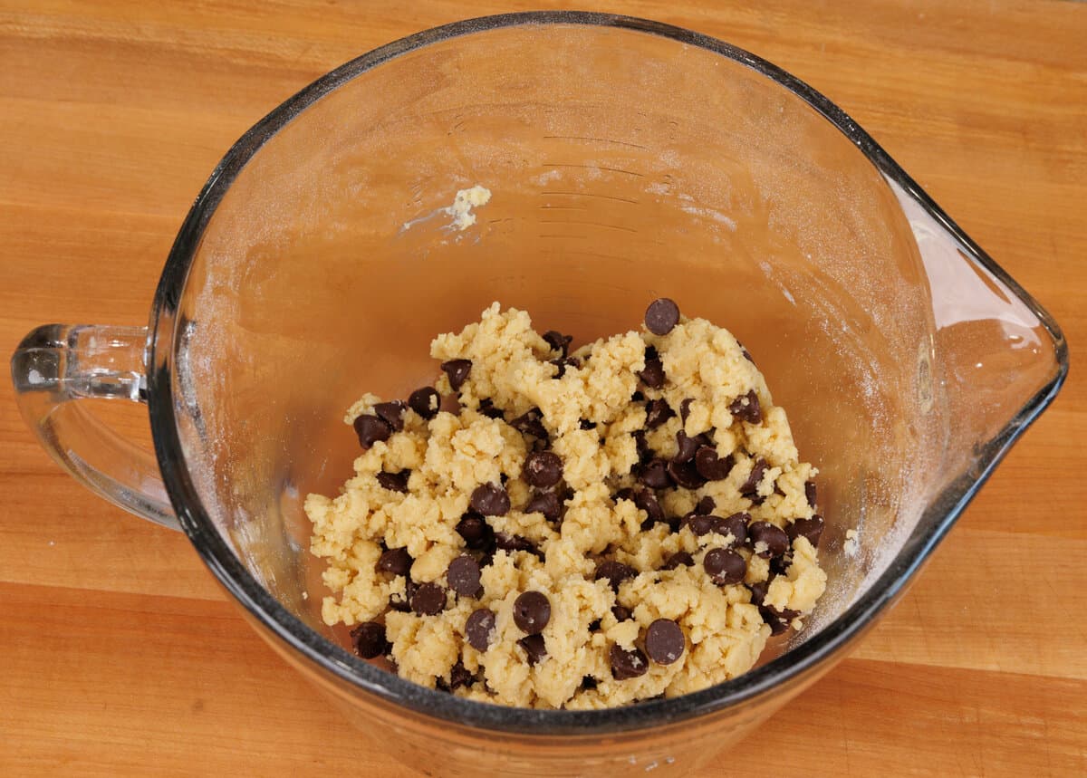 chocolate chip cookie dough batter in a mixing bowl