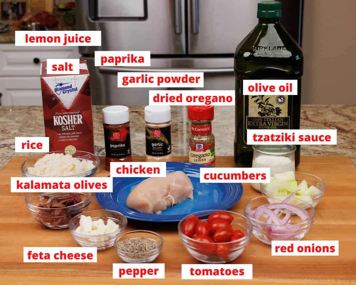 greek chicken bowl ingredients on a kitchen counter