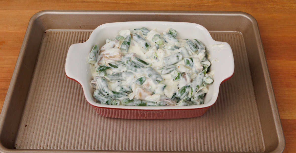 unbaked green bean casserole in a small baking dish