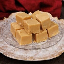a plate filled with peanut butter fudge on a silver tray