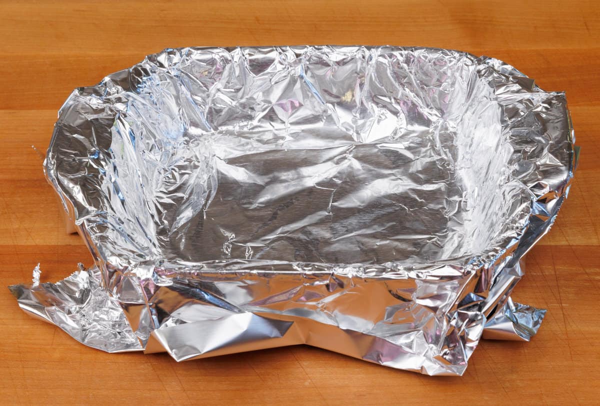 foil lining a small baking dish before adding fudge to the dish