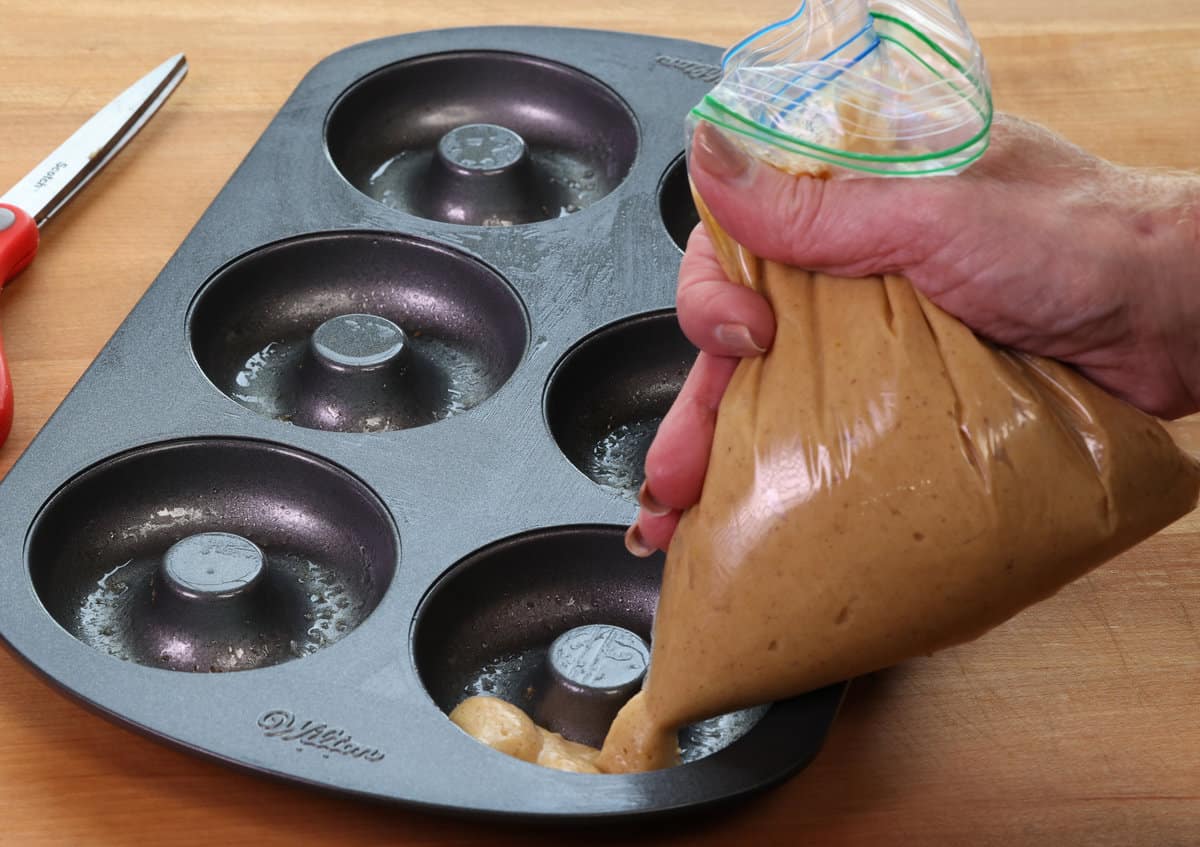 using a ziplock bag to pipe batter into a donut pan
