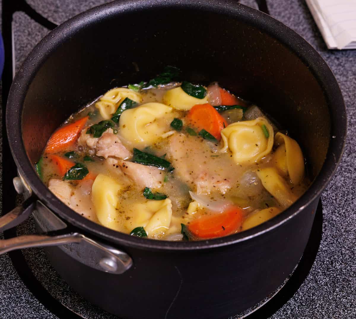 tortellini en brodo with spinach and chicken
