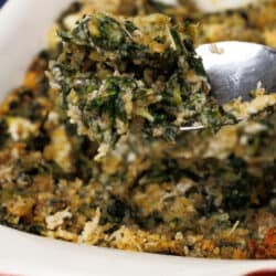 a spoonful of creamed spinach over a baking dish