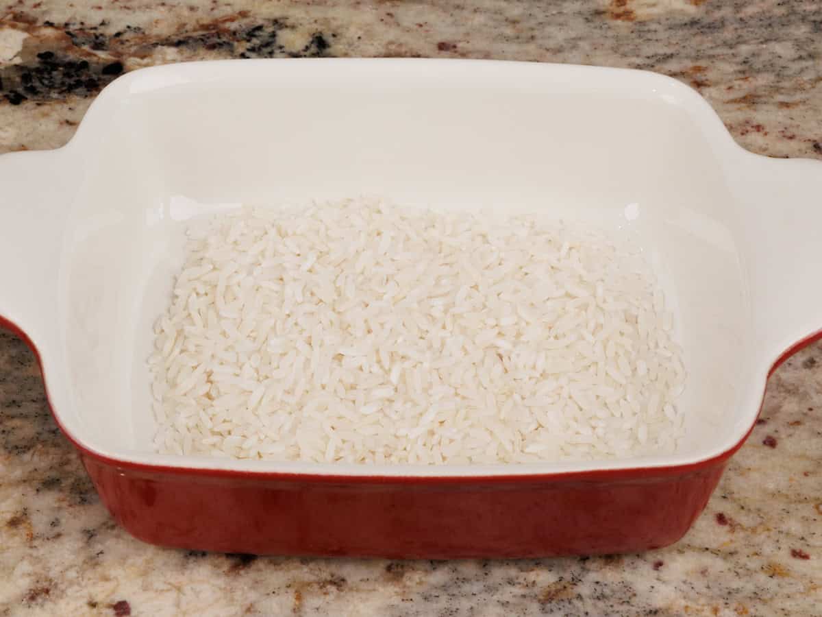 uncooked rice in a baking dish.