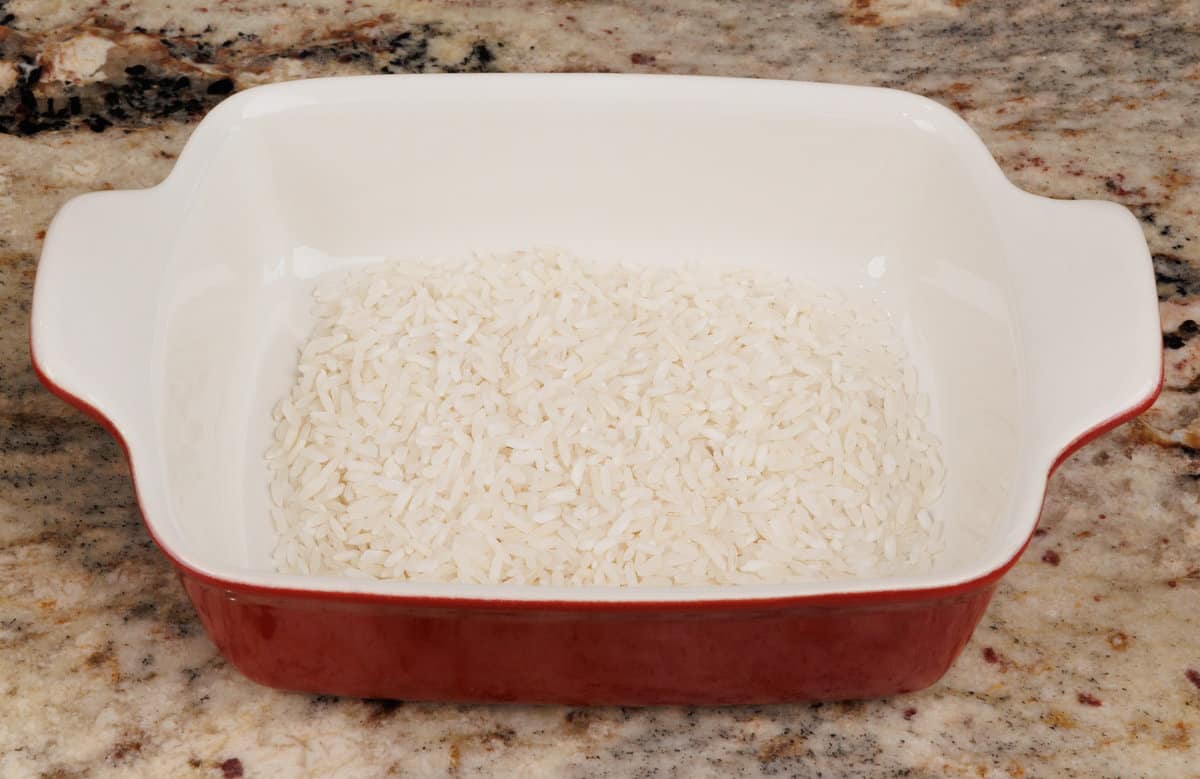 uncooked rice in a small rectangular baking dish