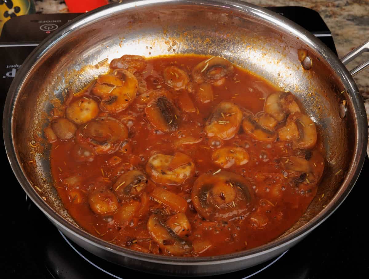 mushroom sauce simmering in a saucepan