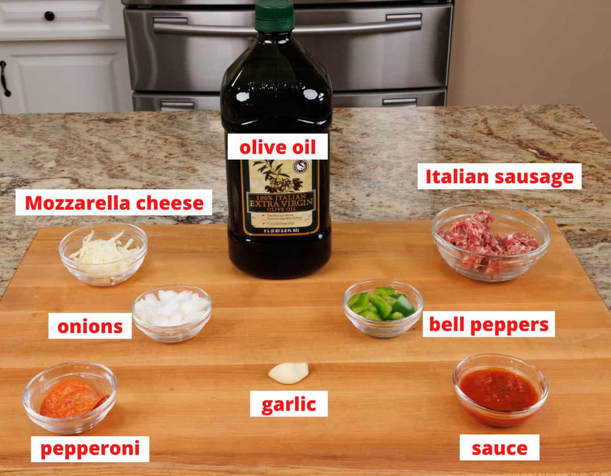 pizza bowl ingredients on a kitchen counter