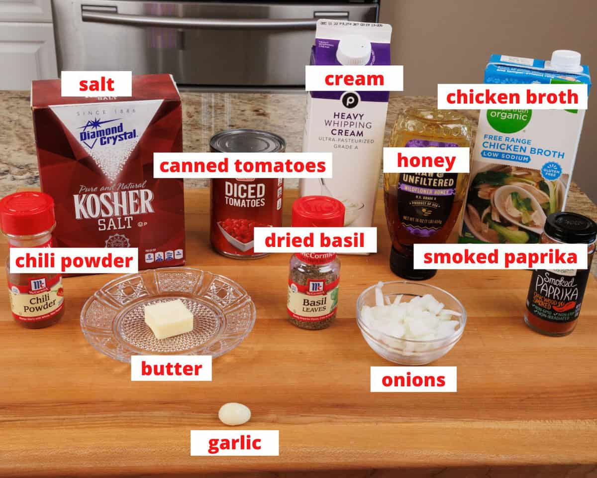 creamy tomato soup ingredients on a kitchen counter