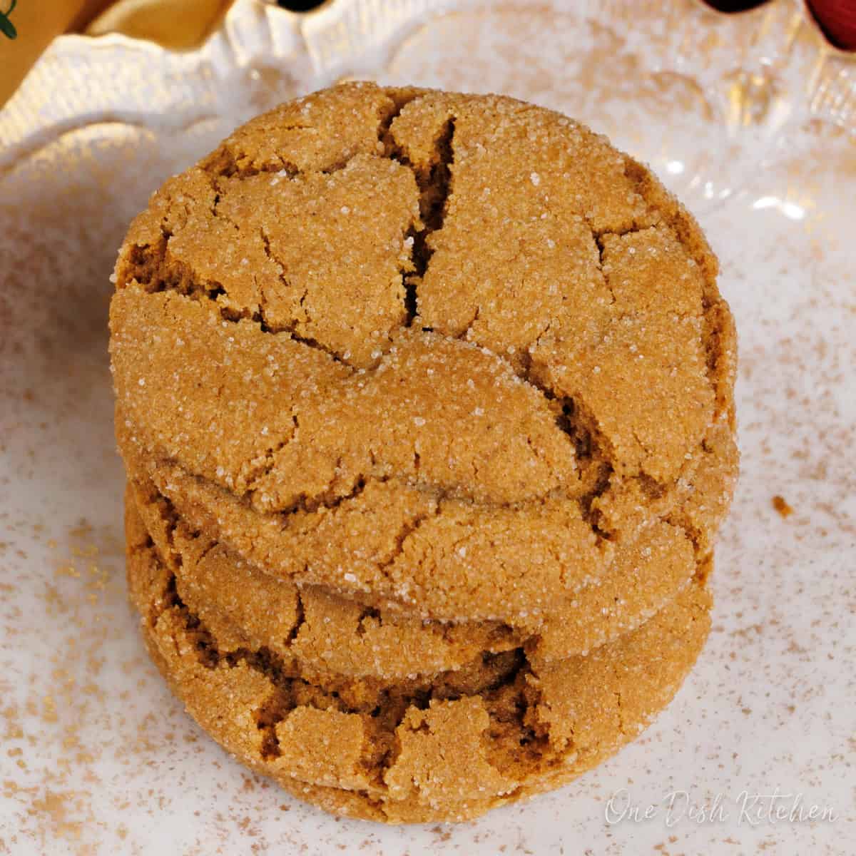 three molasses cookies stacked on top of each other.