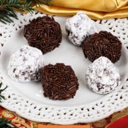 a plate of six rum balls on a tray.