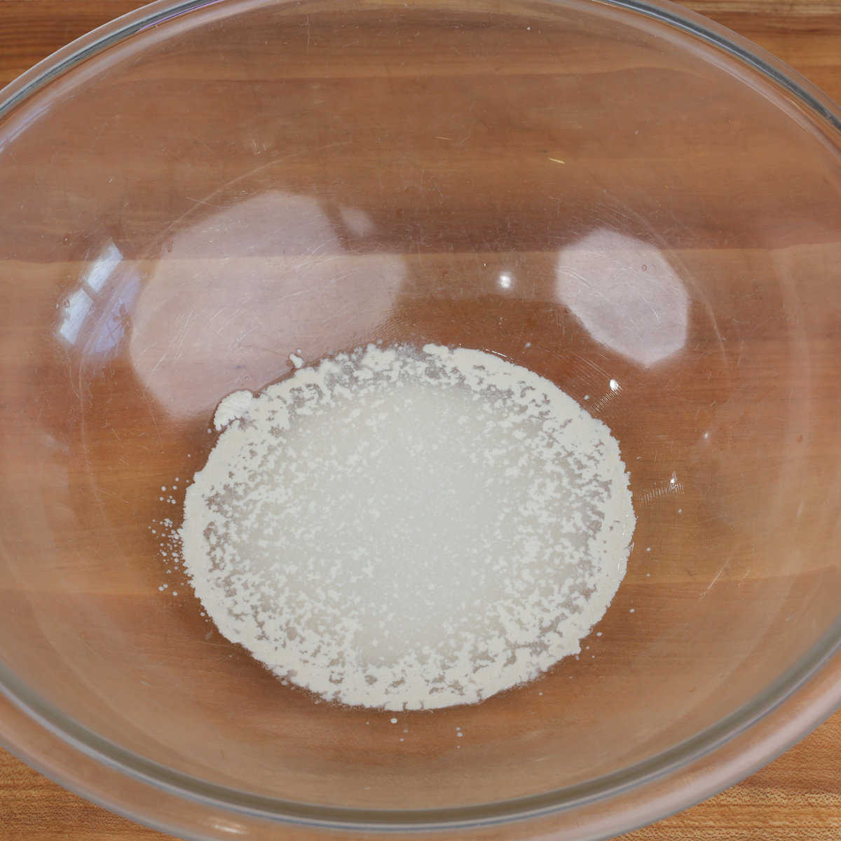 yeast dissolving in water in a large bowl