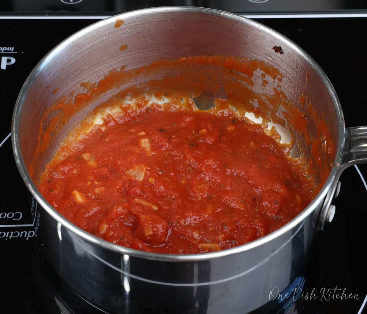 homemade pizza sauce simmering in a small saucepan