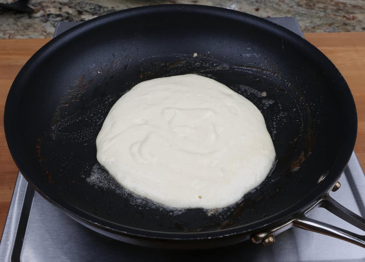 pancake batter in a small skillet.