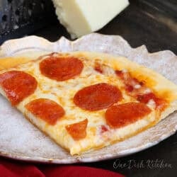 a personal pepperoni pizza on a plate.
