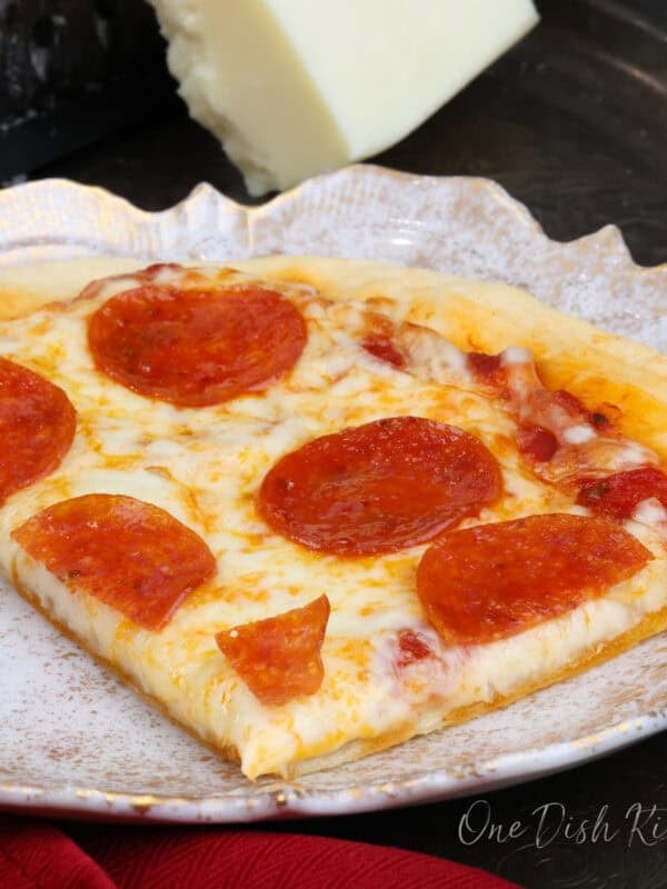 a personal pepperoni pizza on a plate.