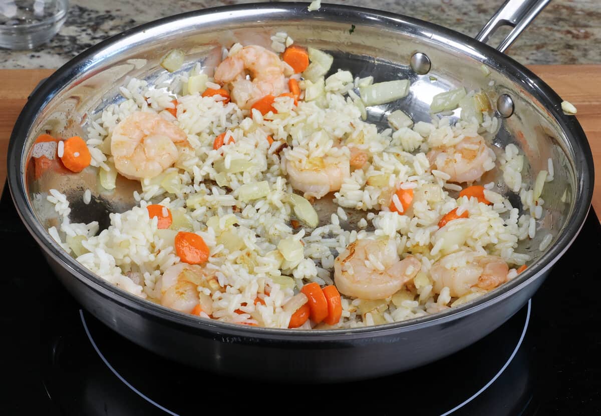shrimp, rice and vegetables in a skillet