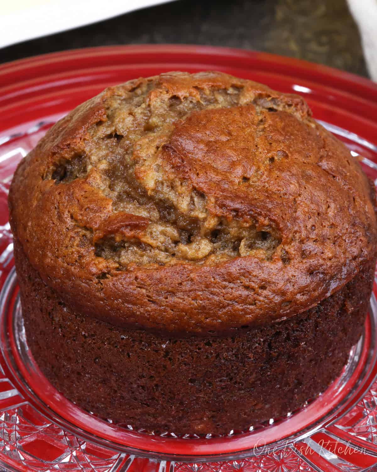 small banana nut bread on a red plate.