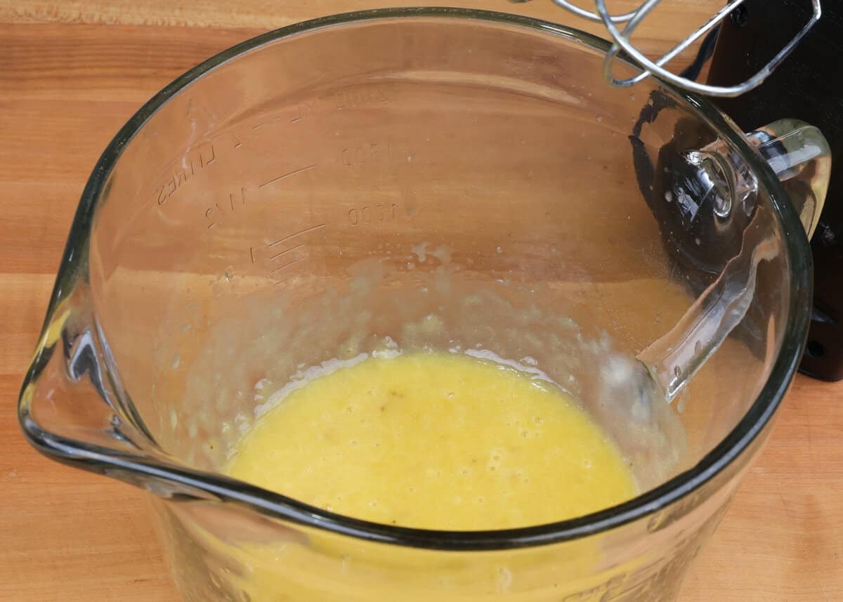 banana nut bread wet ingredients in a mixing bowl.
