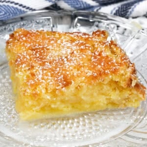 a slice of chess pie on a white plate.