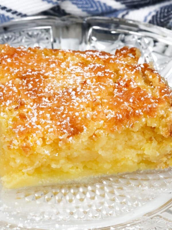 a slice of chess pie on a white plate.