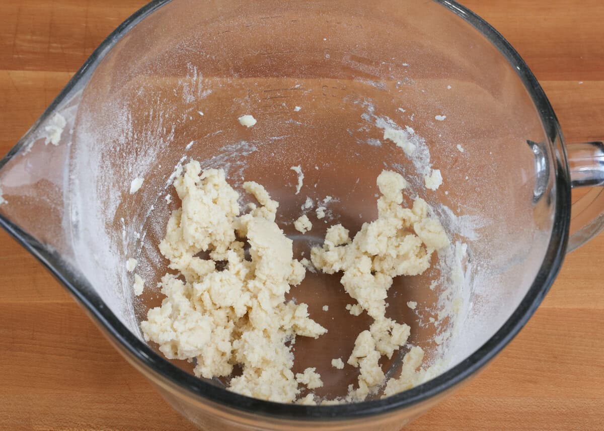 dough for a pie crust in a mixing bowl.