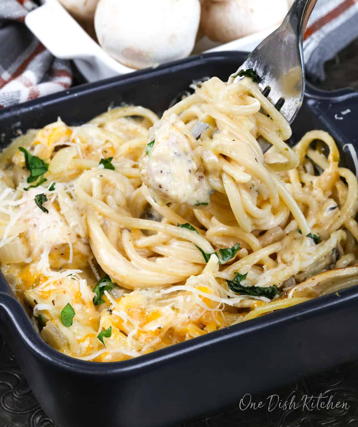 a single serve chicken tetrazzini in a black baking dish.