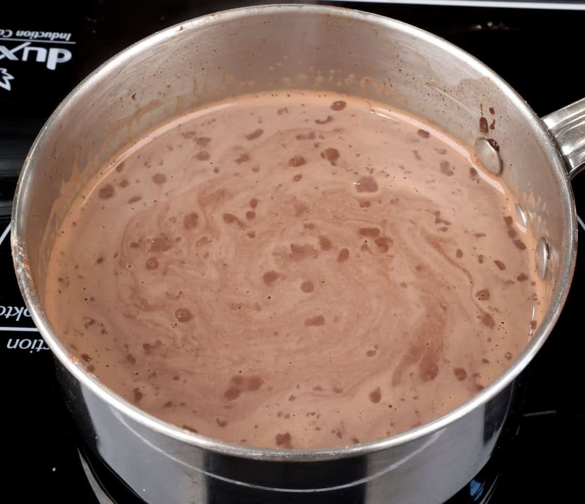 chocolate pudding simmering in a pot.