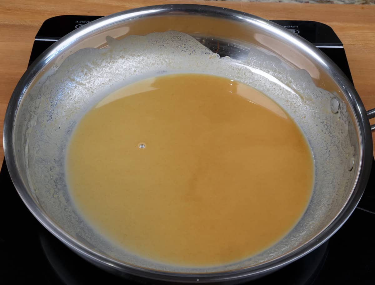 a roux that is the color of peanut butter in a skillet