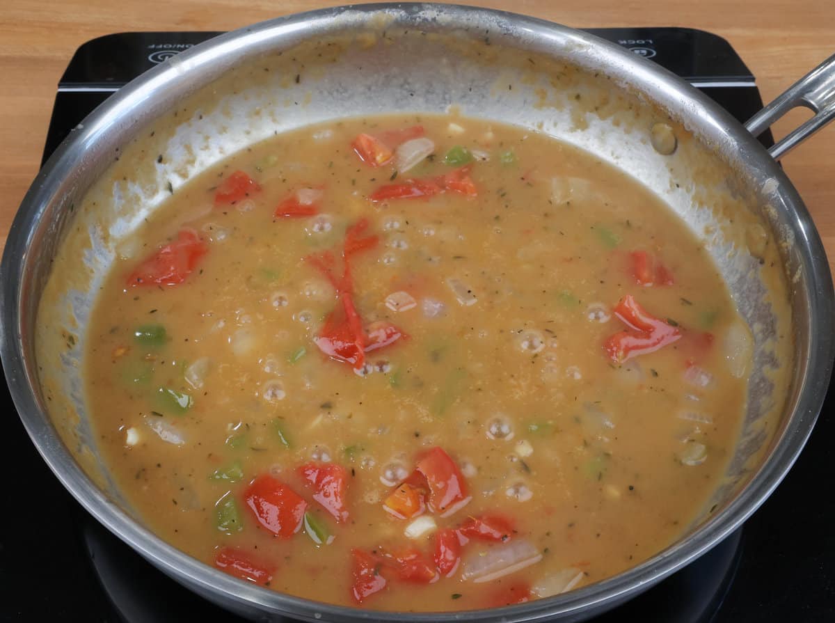 etouffee sauce simmering in a skillet