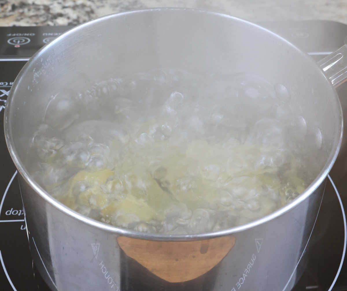 jumbo pasta shells cooking in boiling water