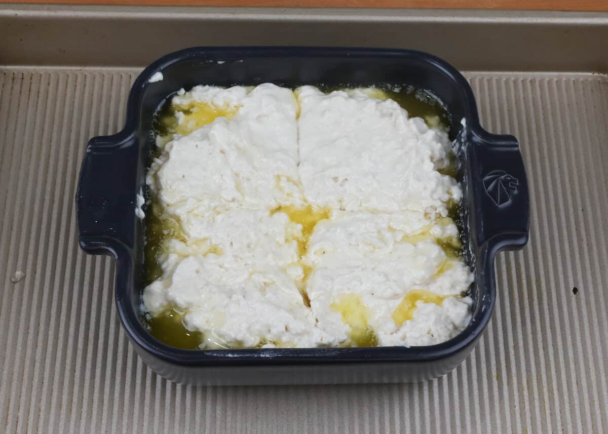 unbaked butter swim biscuits in a small baking dish.