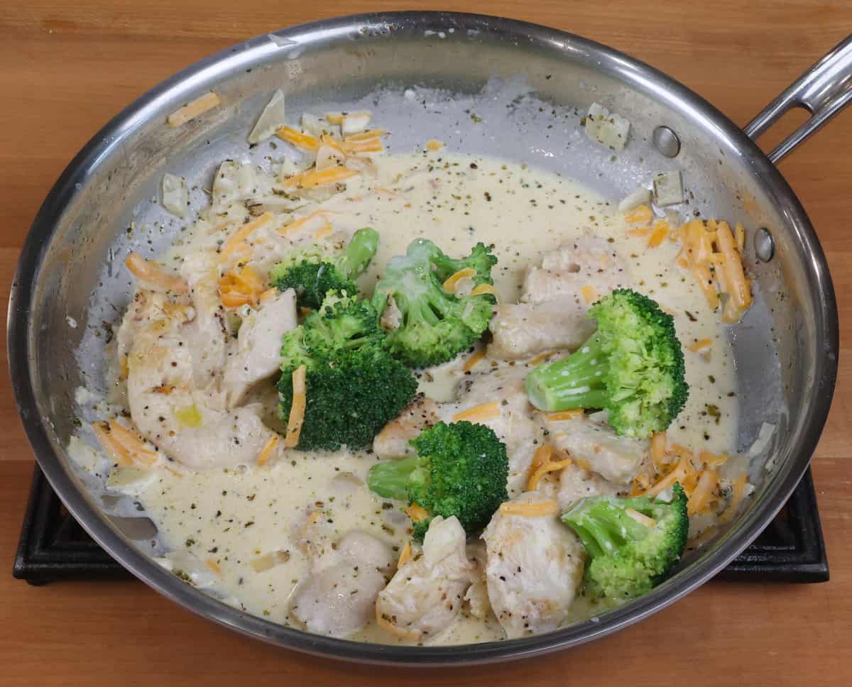 broccoli, chicken and sauce in a pan.