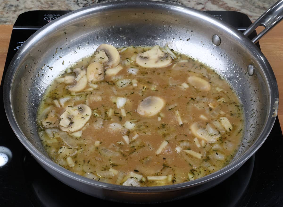 marsala sauce simmering on a saucepan on the stove