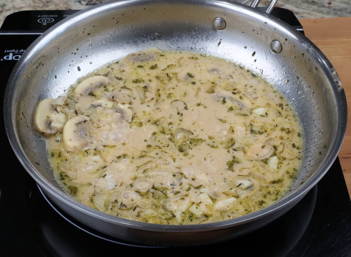 marsala sauce with cream simmering in a pan