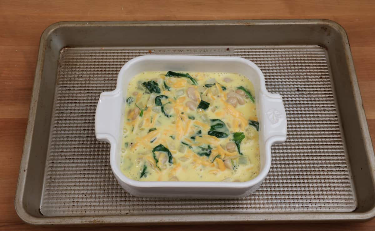 unbaked coronation quiche in a baking dish