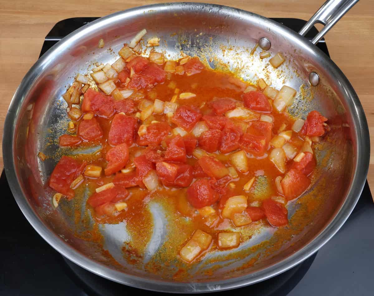 diced tomatoes in a skillet.