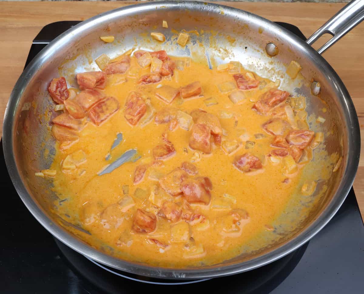 creamy paprika sauce simmering in a skillet.