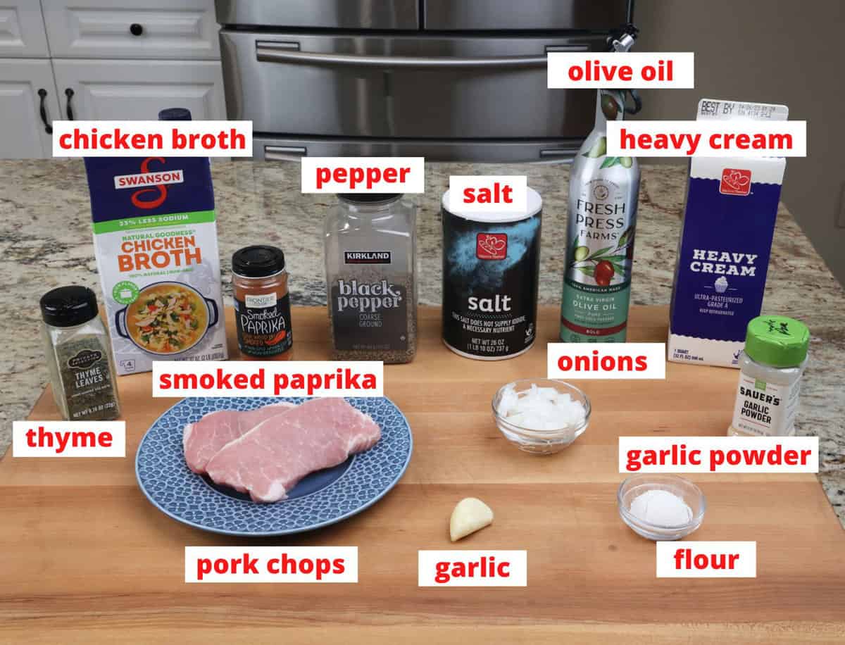 smothered pork chops ingredients on a kitchen counter.