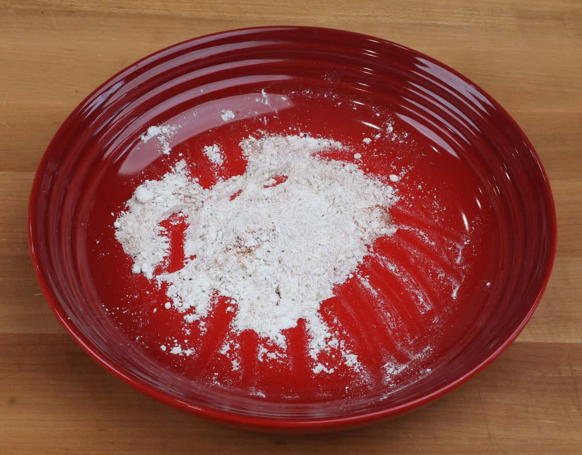 flour and spices in a small red bowl.