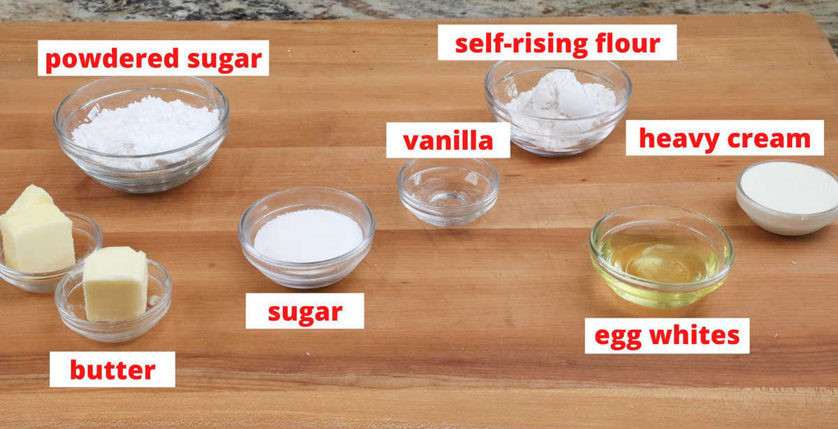 ingredients for a white cake and white cake frosting on a kitchen counter.