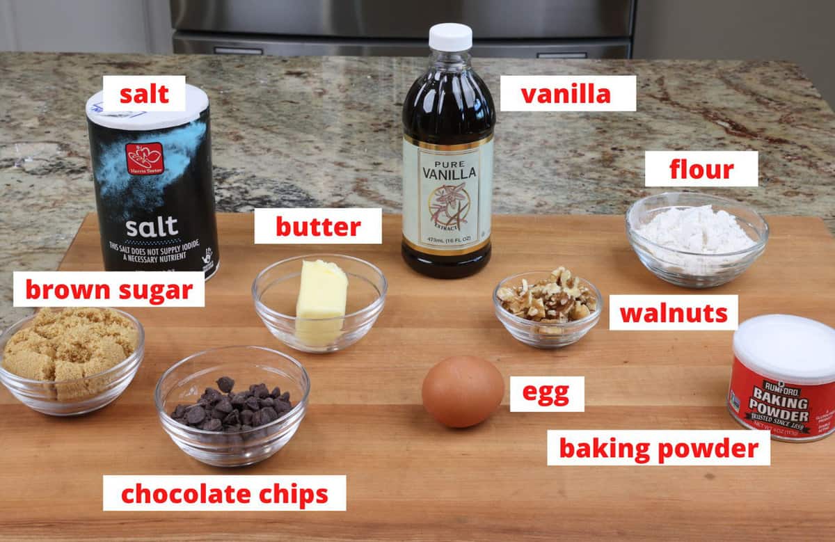 ingredients or blondies with chocolate chips and walnuts on a kitchen counter.
