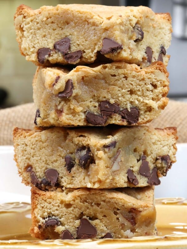 four blondies stacked on top of each other on a brown plate