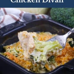 chicken divan in a small black baking dish with a fork on the side.