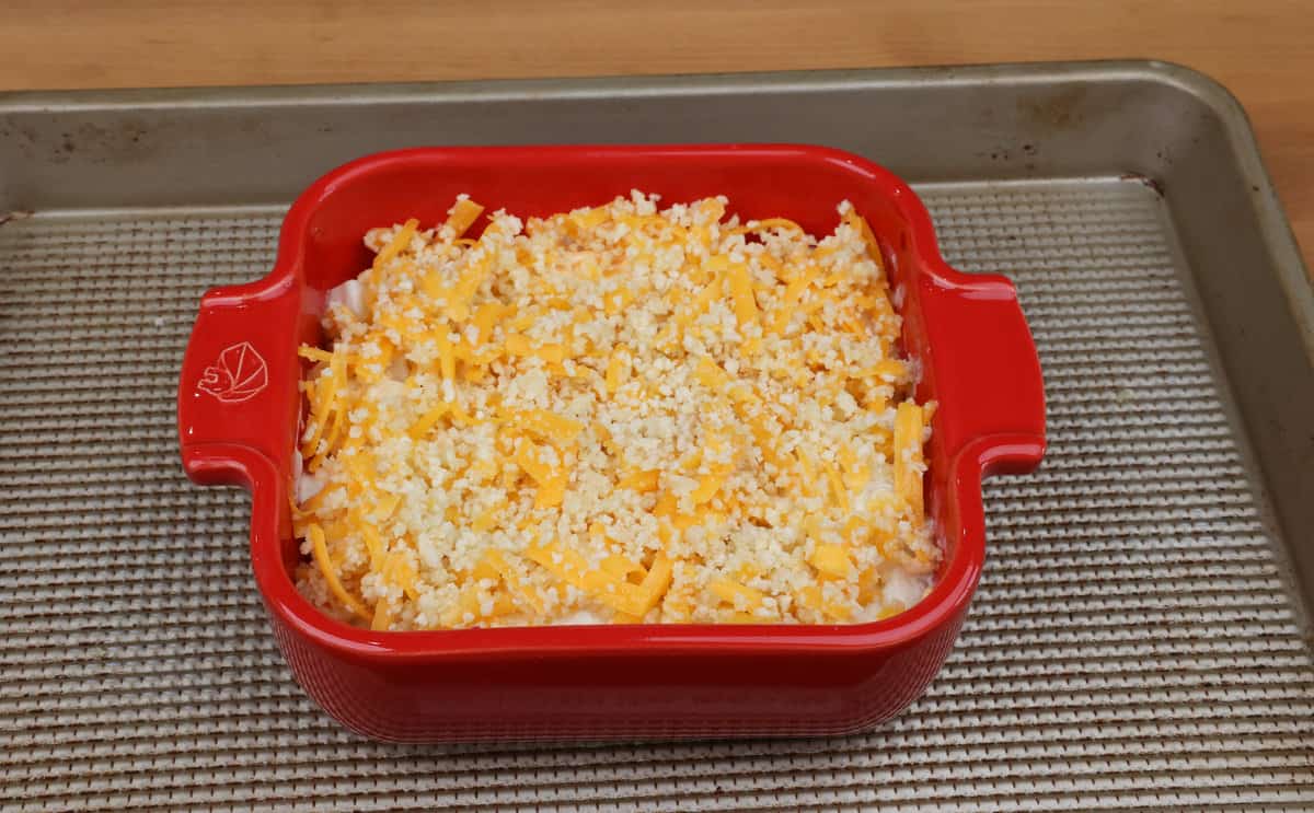 an unbaked hashbrown casserole in a baking dish.