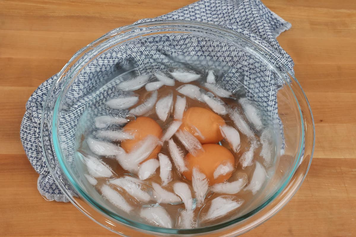 hard boiled eggs in a bowl of ice water