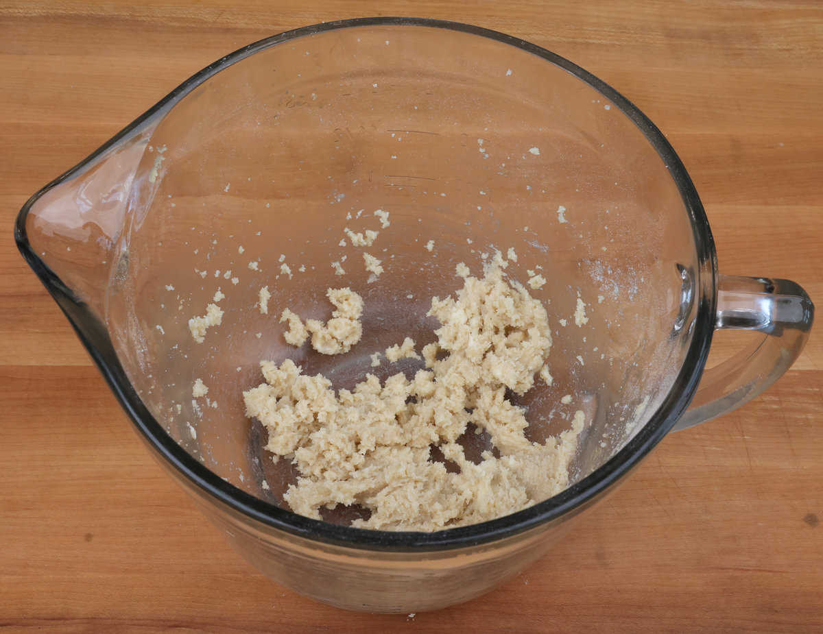 sugar and butter blended together in a mixing bowl.
