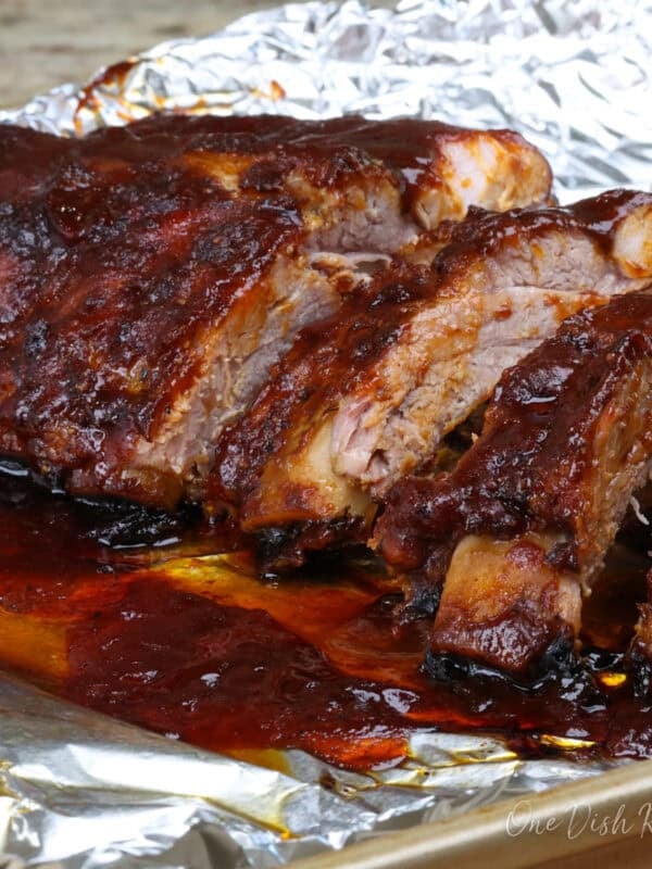 a single serving of oven baked ribs topped with barbecue sauce.
