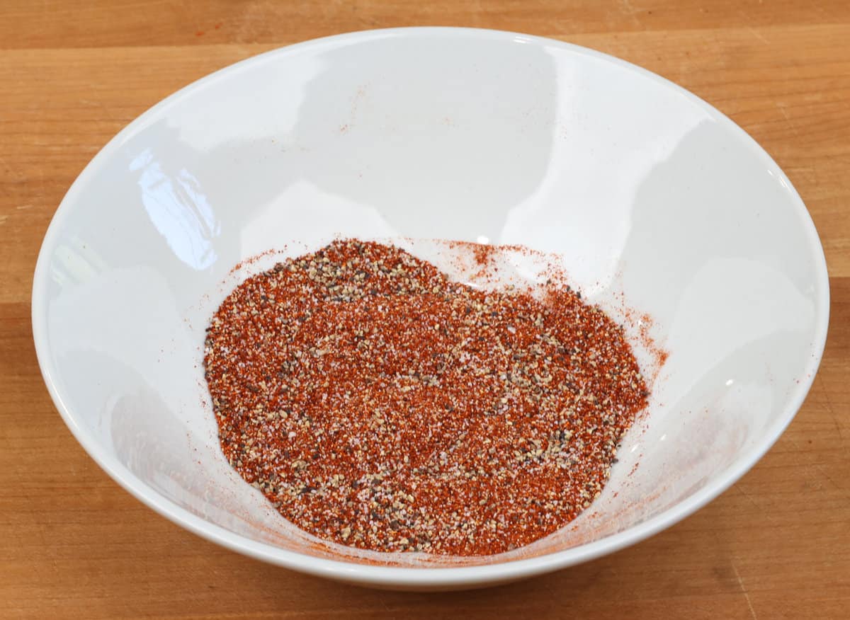 dry rub ingredients for ribs in a small white bowl.